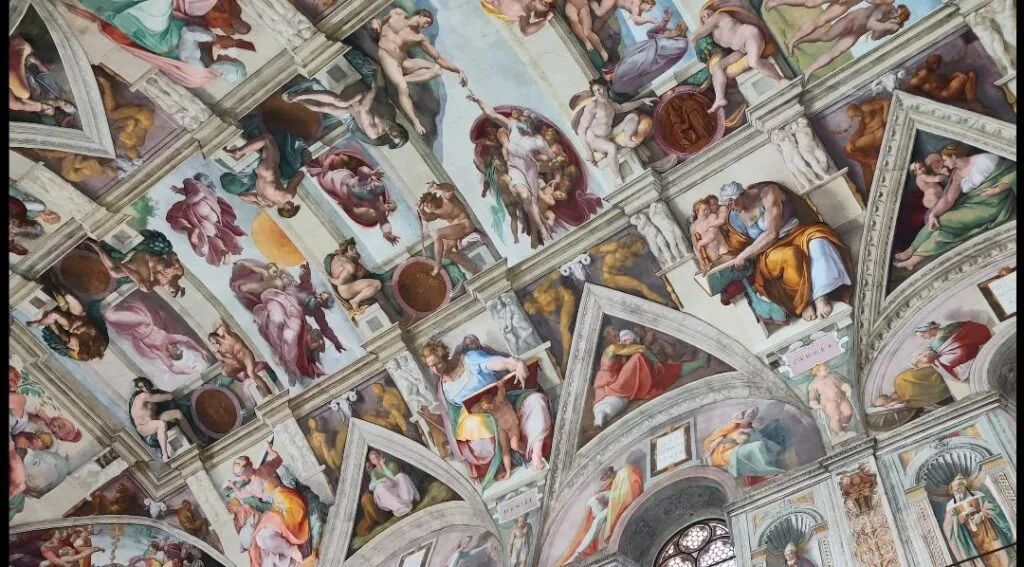 A photo of Michaelangelo's creation painting in the Sistine chapel.