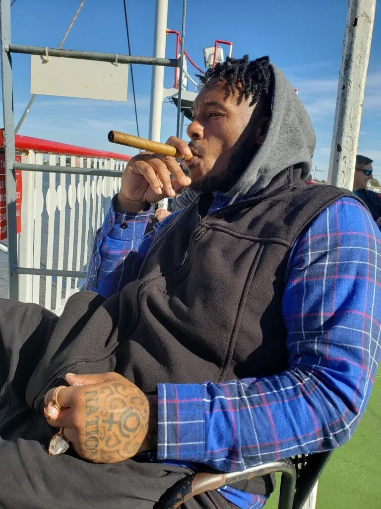 Picture of my brother Path enjoying a unlit cigar.